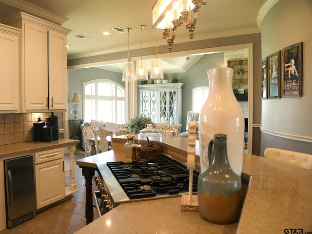 a living room with furniture a flat screen tv and a window
