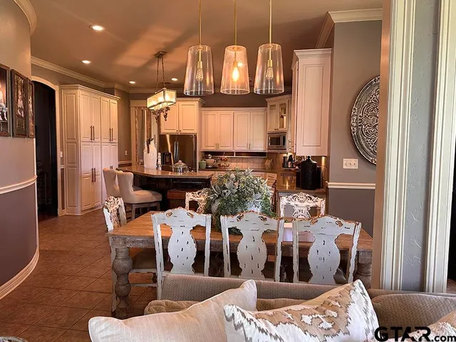 a view of an entryway with wooden floor and door