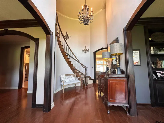 a view of a livingroom with furniture hardwood floor and a livingroom