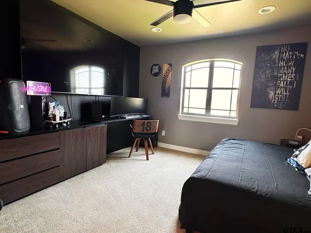 a hallway with a couch and painting on the wall