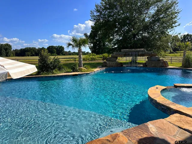 a view of a swimming pool with a lake view