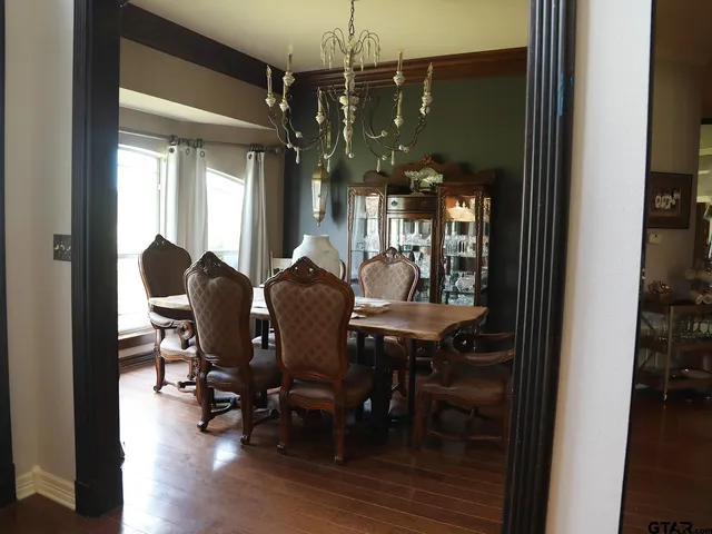 a kitchen with a stove a sink and cabinets