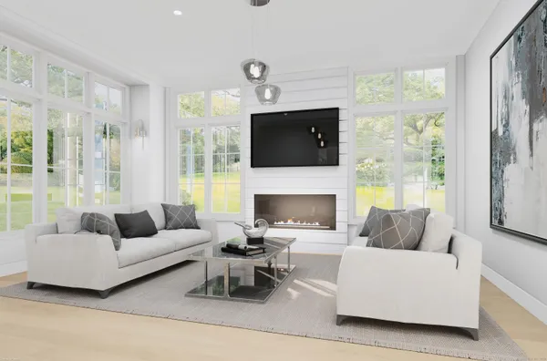 a living room with furniture a flat screen tv and a floor to ceiling window