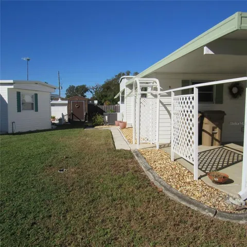 a view of a backyard of the house