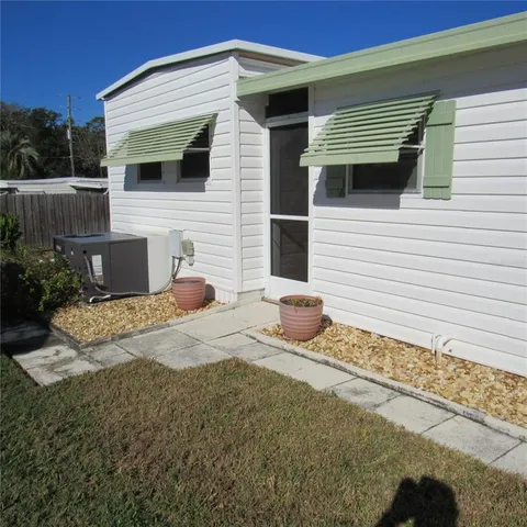 a view of wooden floor and windows in an empty room