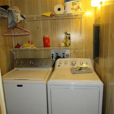an empty room with wooden floor and closet