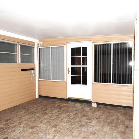 a view of storage and utility room with racks a chair