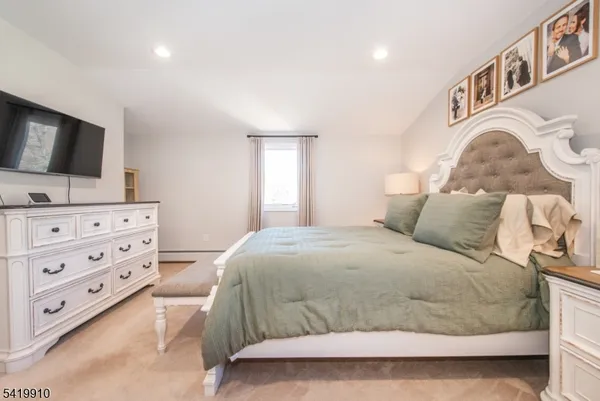 a bedroom with a bed and couch
