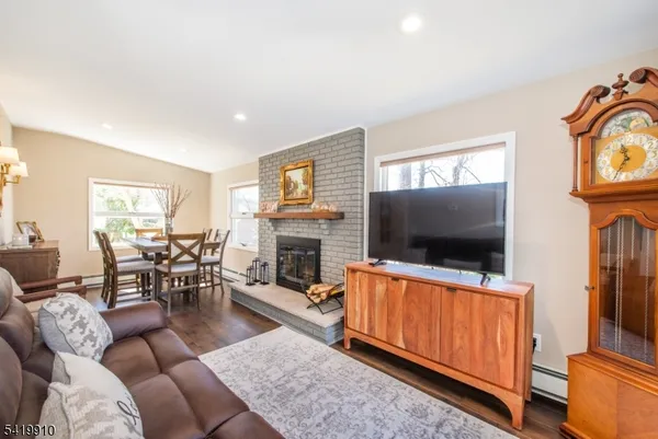 a dining room with furniture and a fireplace