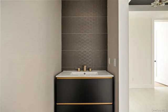 a bathroom with a toilet and a sink