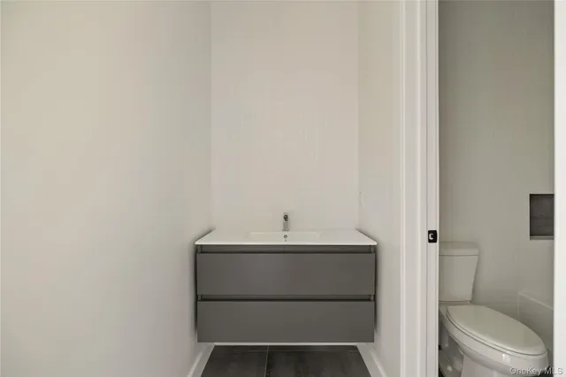 a white bath tub sitting next to a white toilet