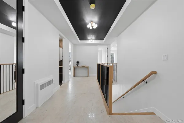 a view of a hallway with a white walls