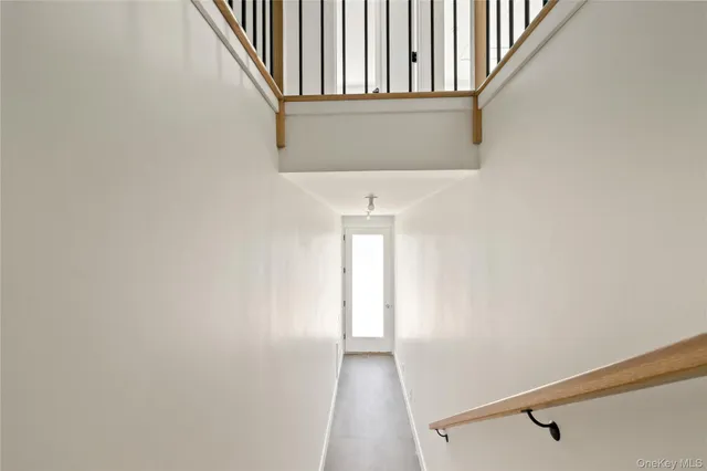 a view of a hallway with stairs