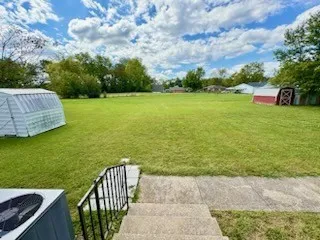 a view of a garden with an outdoor space