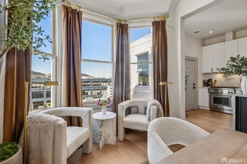 a kitchen with stainless steel appliances granite countertop a sink and a stove