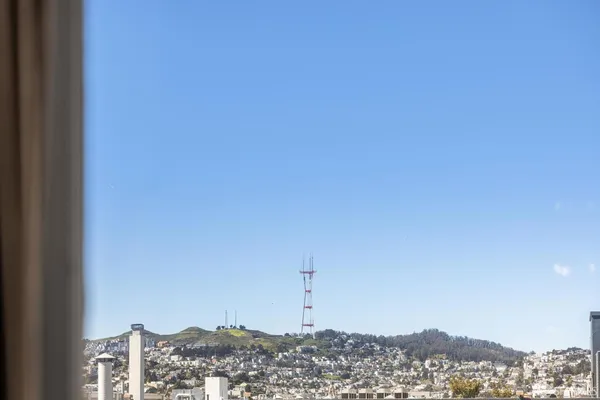 a kitchen with granite countertop white cabinets and stainless steel appliances