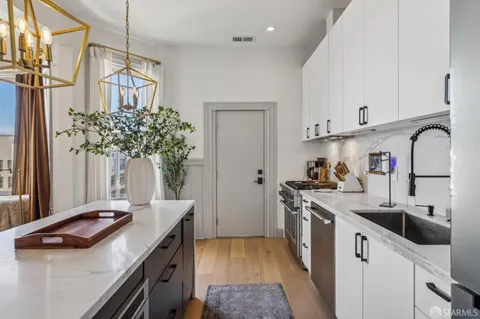 a bedroom with a bed and a cabinet