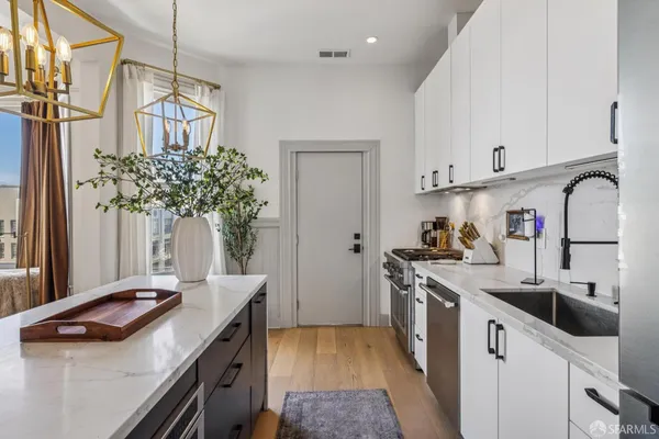 a bedroom with a bed and a cabinet
