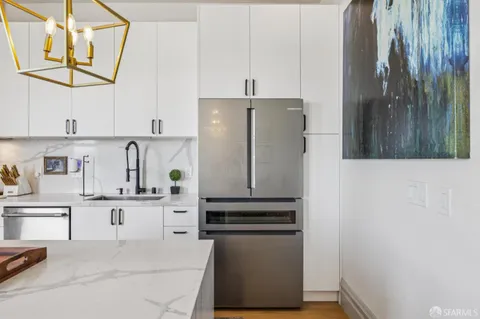 a bathroom with a sink a mirror and shower