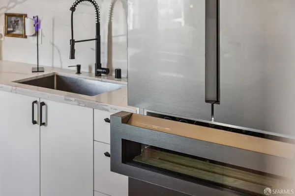 a bedroom with a bed mirror and a window