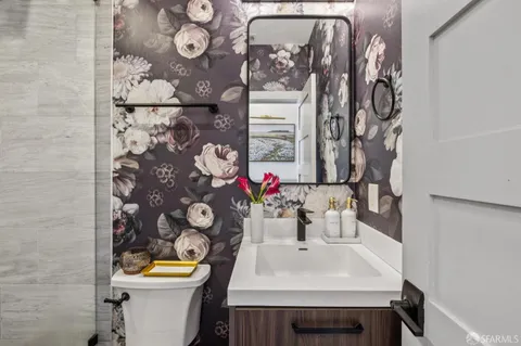 a backyard of a house with table and chairs