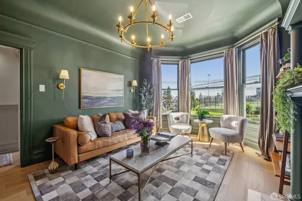 a living room with furniture and a book shelf