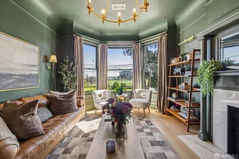 a dining room with furniture and wooden floor