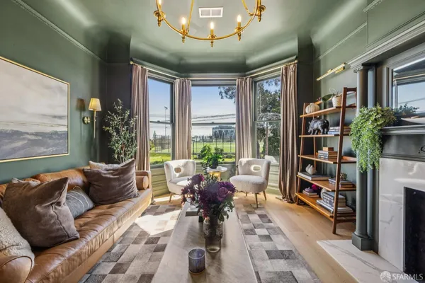 a dining room with furniture and wooden floor
