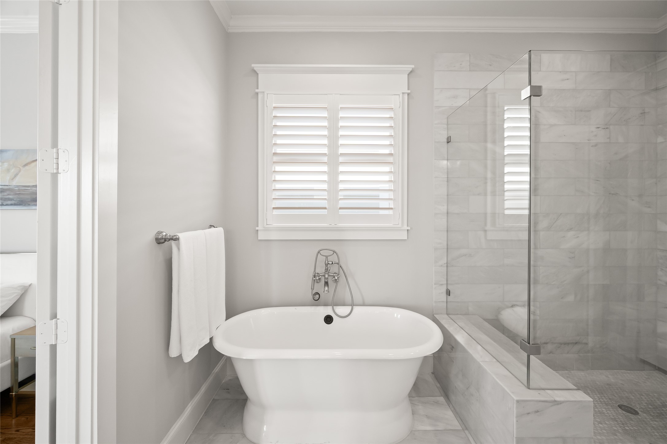 1003 East 25th Street Houston, TX 77009 - Photo 24 of 33 Luxury at its finest - cozy soaking tub and oversized glass enclosed shower make you feel as if you are transported to the best spa-like get away.
