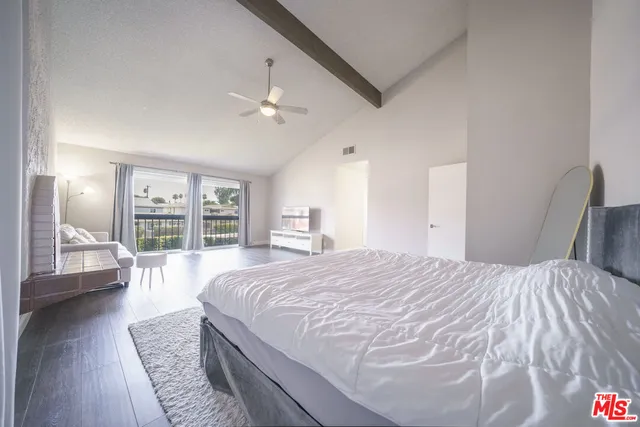 a spacious bathroom with a granite countertop sink mirror and a shower