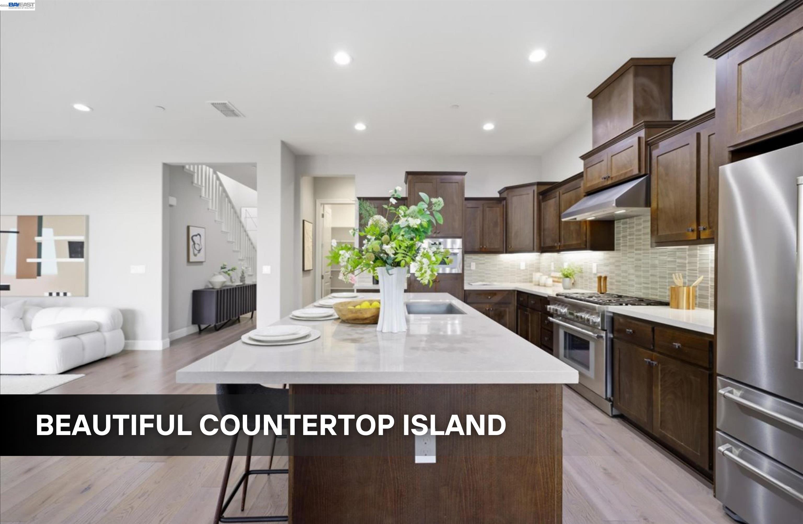 39438 Humpback Whale Road Newark, CA 94560 - Photo 11 of 51 a view of kitchen center island and stainless steel appliances