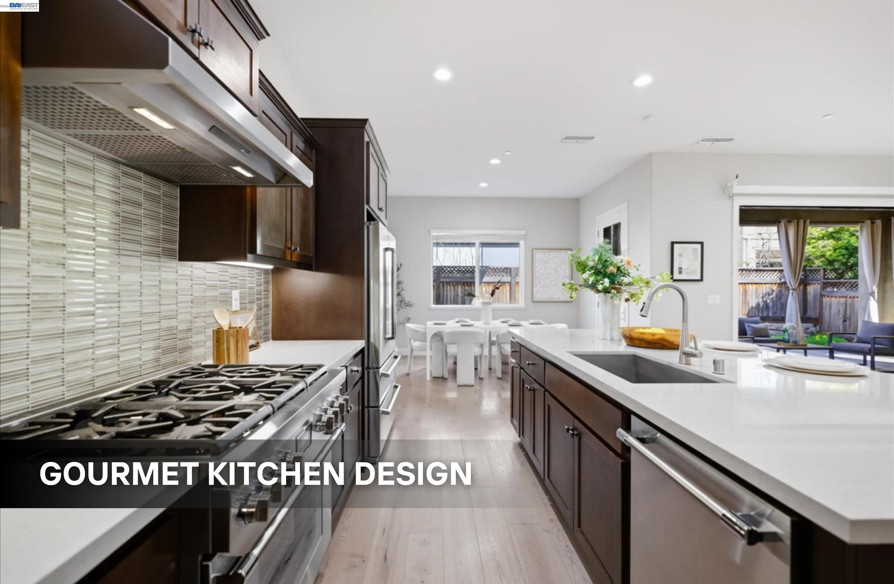 39438 Humpback Whale Road Newark, CA 94560 - Photo 12 of 51 a kitchen with stainless steel appliances granite countertop a stove a sink dishwasher and a microwave
