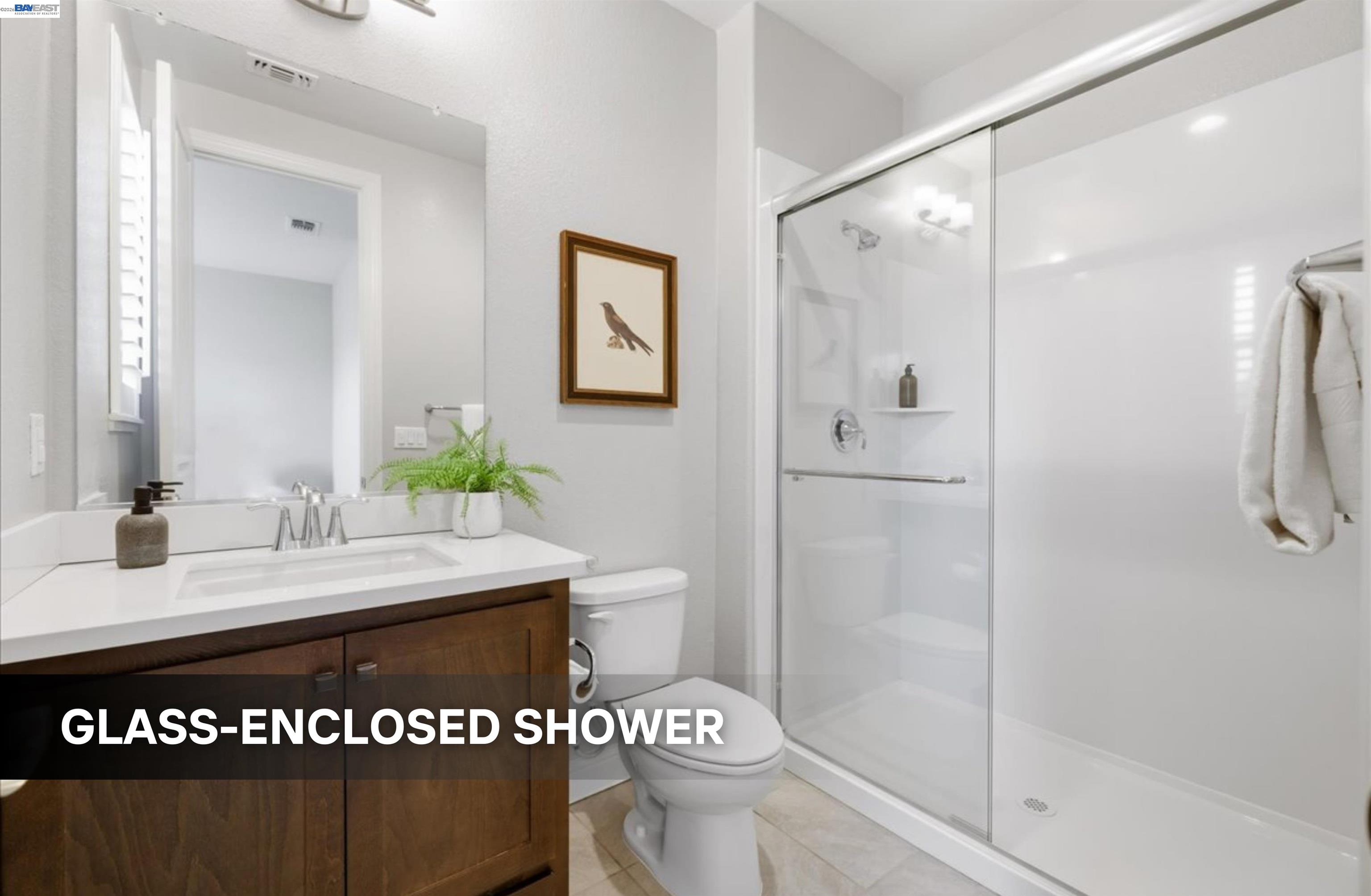 39438 Humpback Whale Road Newark, CA 94560 - Photo 21 of 51 a bathroom with a sink a toilet and shower