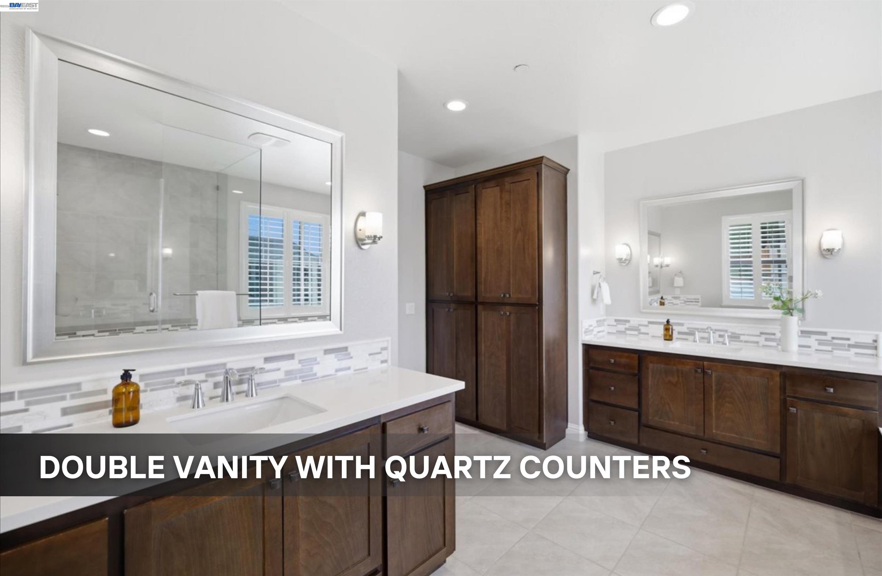 39438 Humpback Whale Road Newark, CA 94560 - Photo 30 of 51 a bathroom with a sink a granite counter and a mirror
