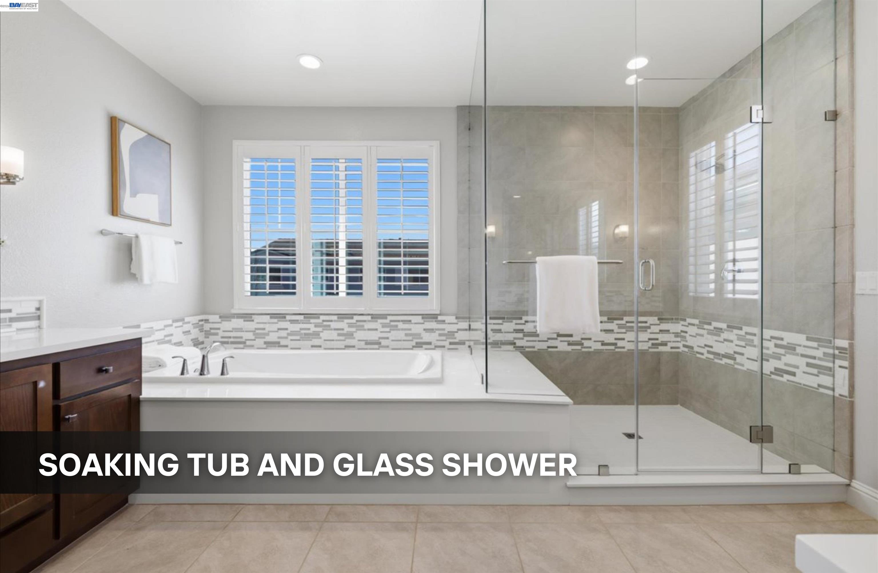 39438 Humpback Whale Road Newark, CA 94560 - Photo 31 of 51 a view of a spacious bathroom with a tub and shower