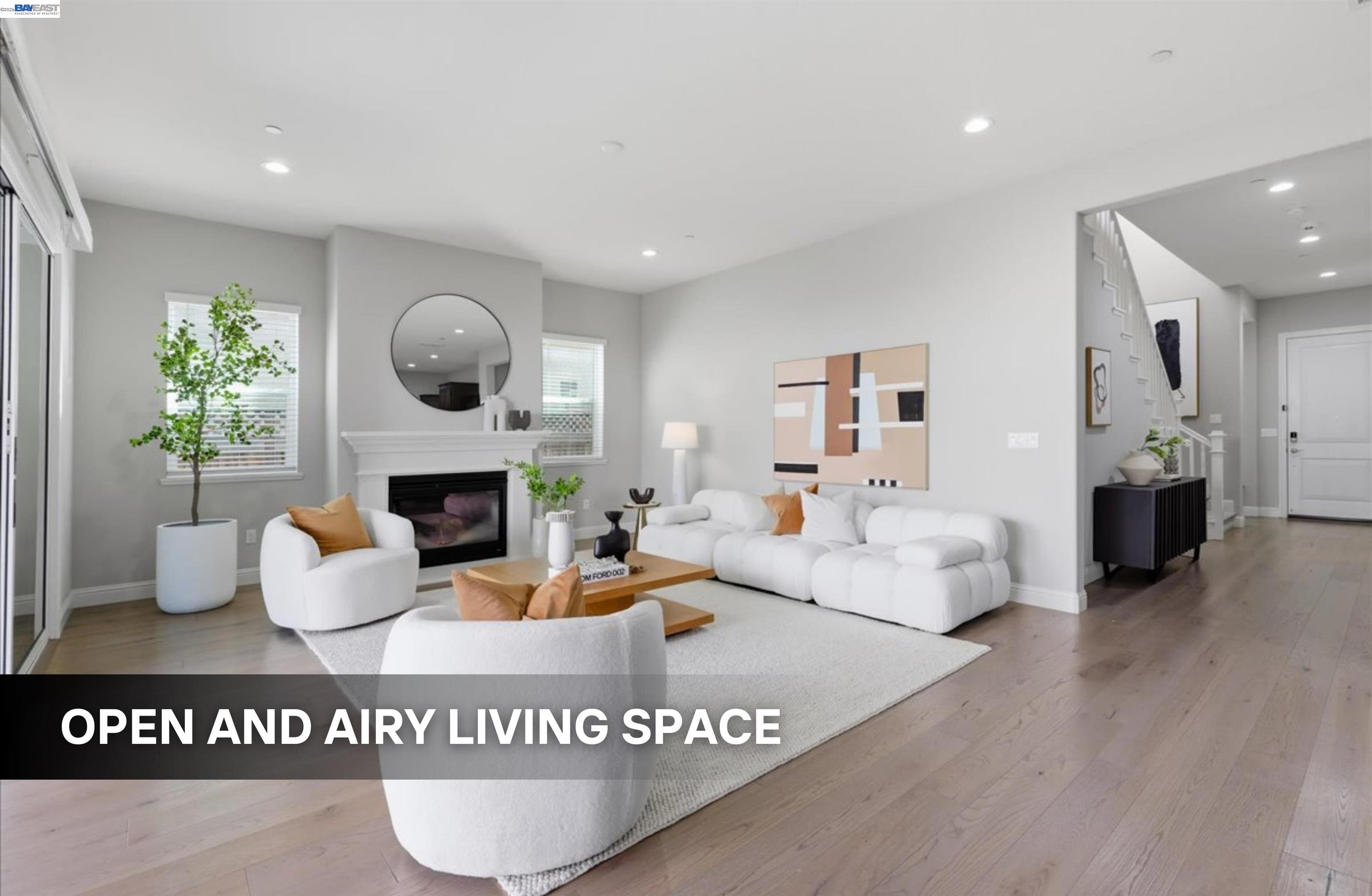 39438 Humpback Whale Road Newark, CA 94560 - Photo 4 of 51 a living room with furniture a fireplace and window