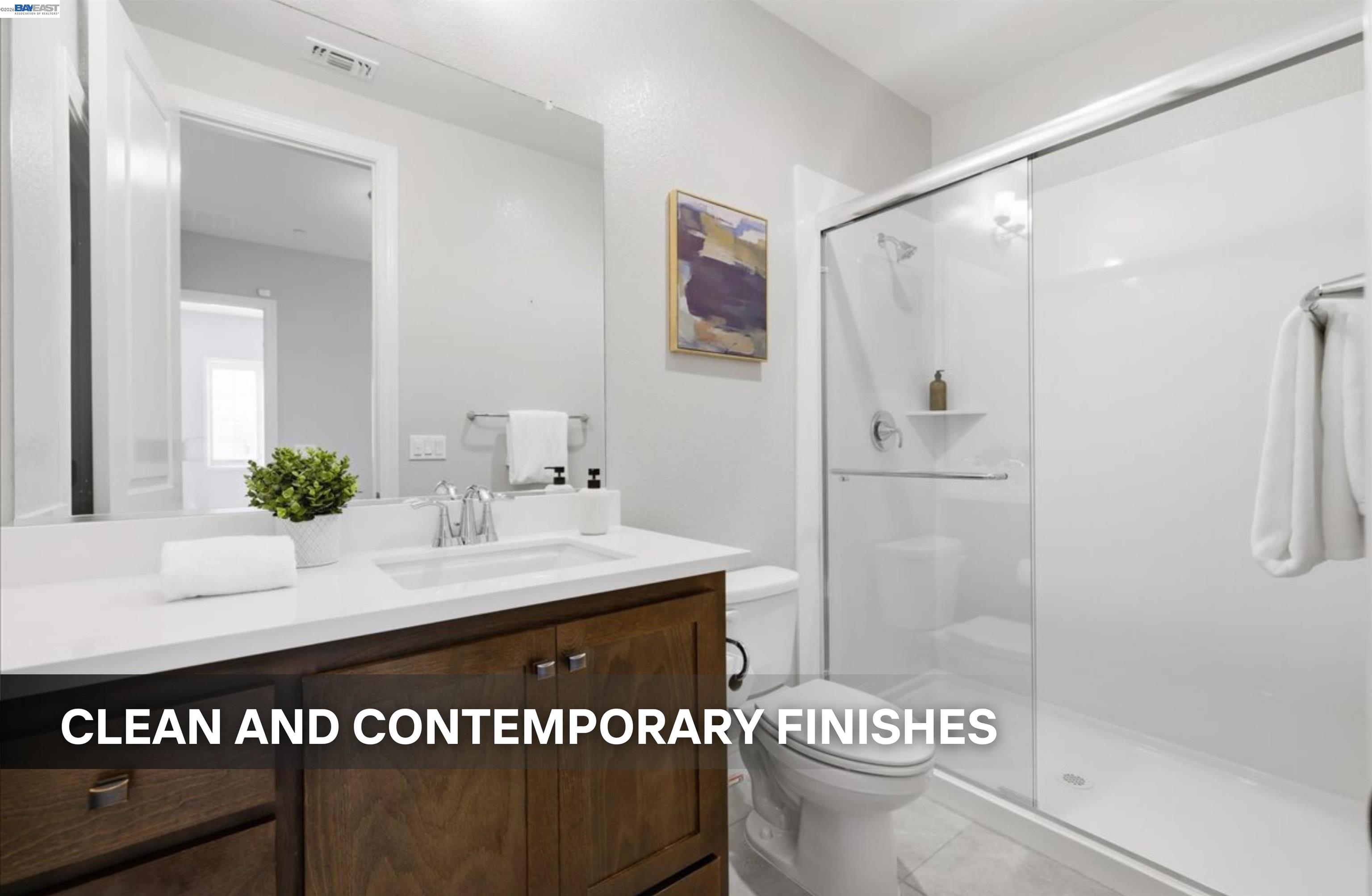 39438 Humpback Whale Road Newark, CA 94560 - Photo 42 of 51 a bathroom with a sink a toilet and shower