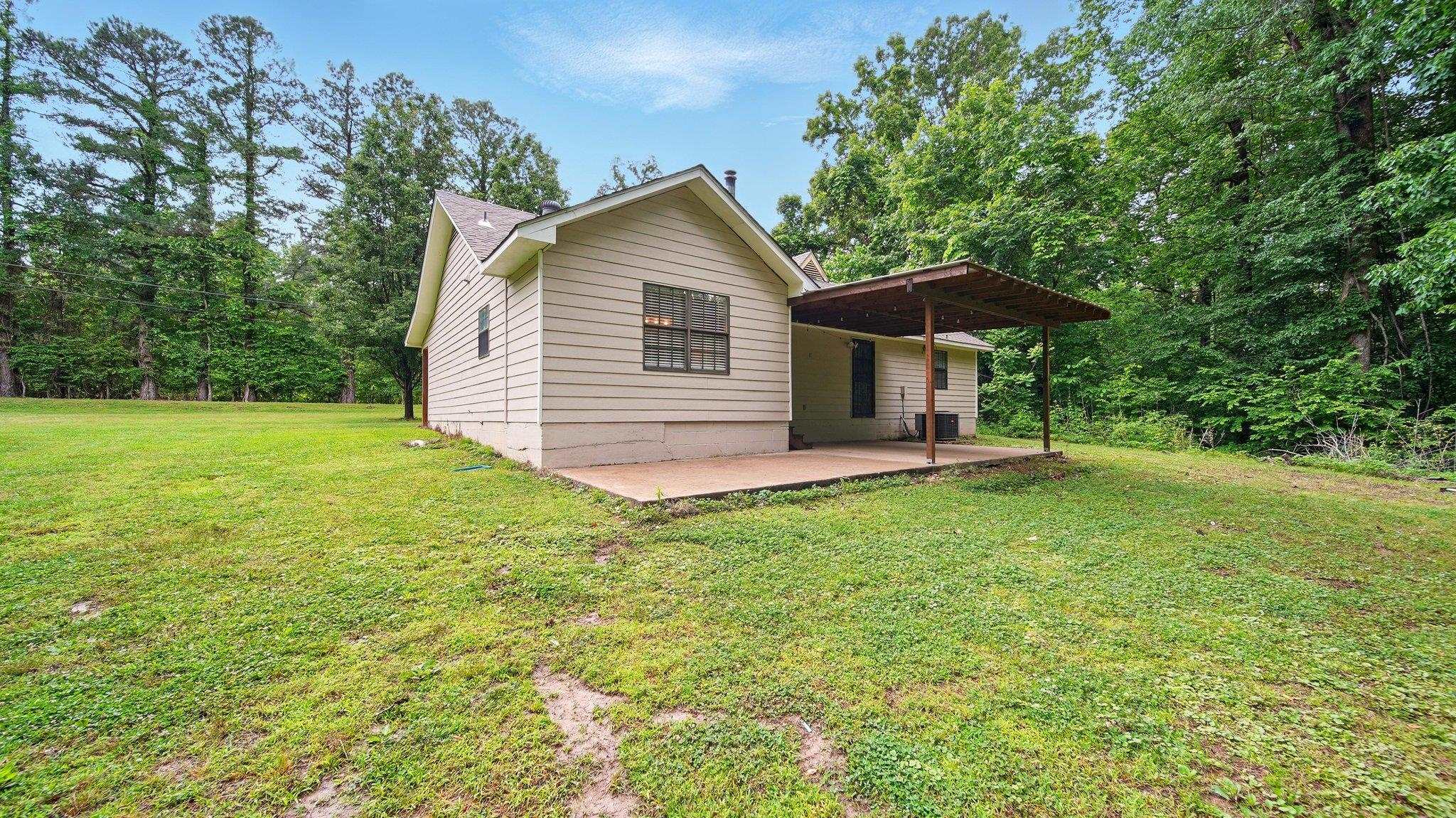 979 Ray Bluff Road Millington, TN 38053 - Photo 6 of 21 View of home's exterior featuring a patio area