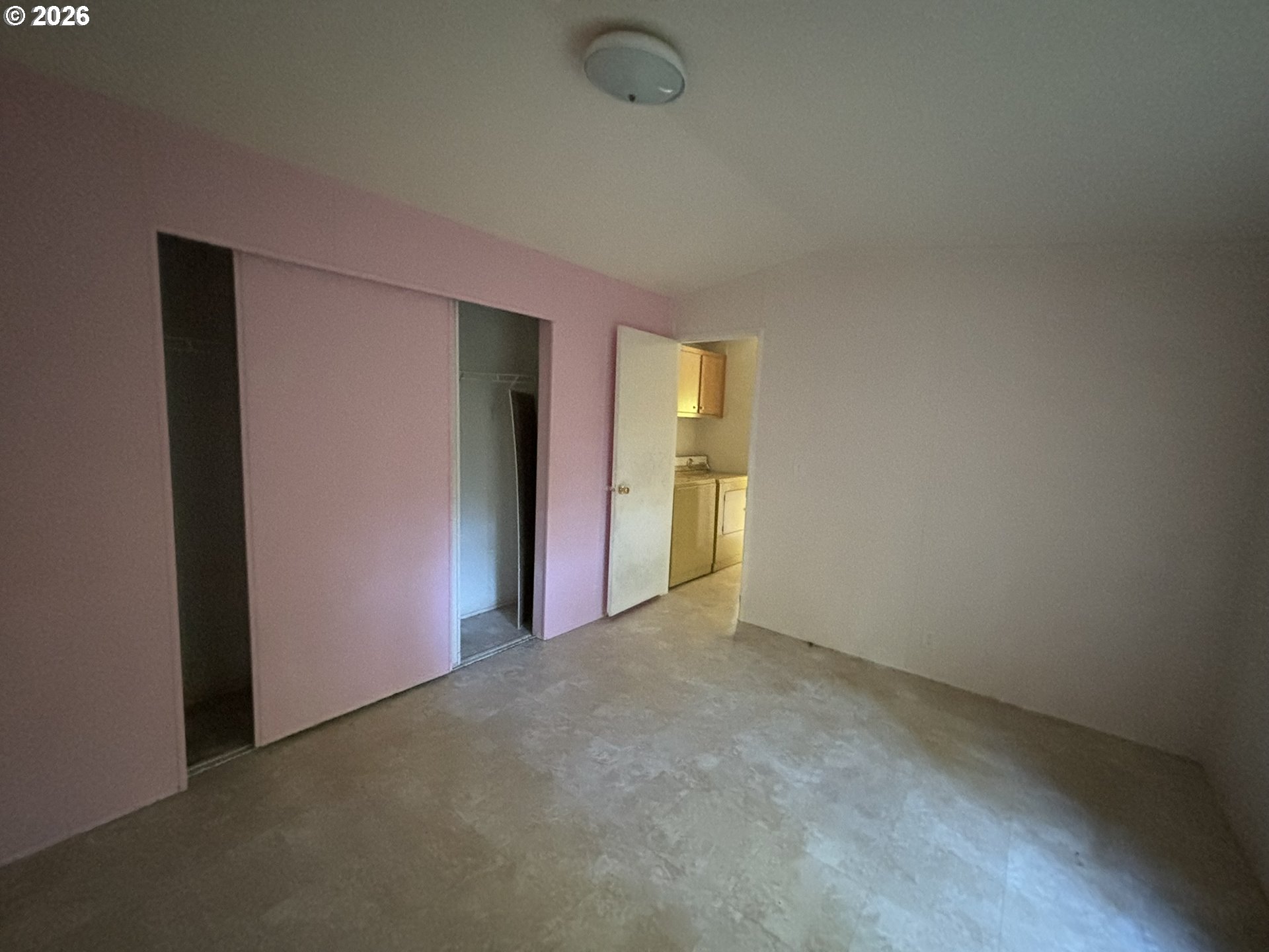 64 Outer Drive Florence, OR 97439 - Photo 4 of 8 a view of an empty room with closet and a window
