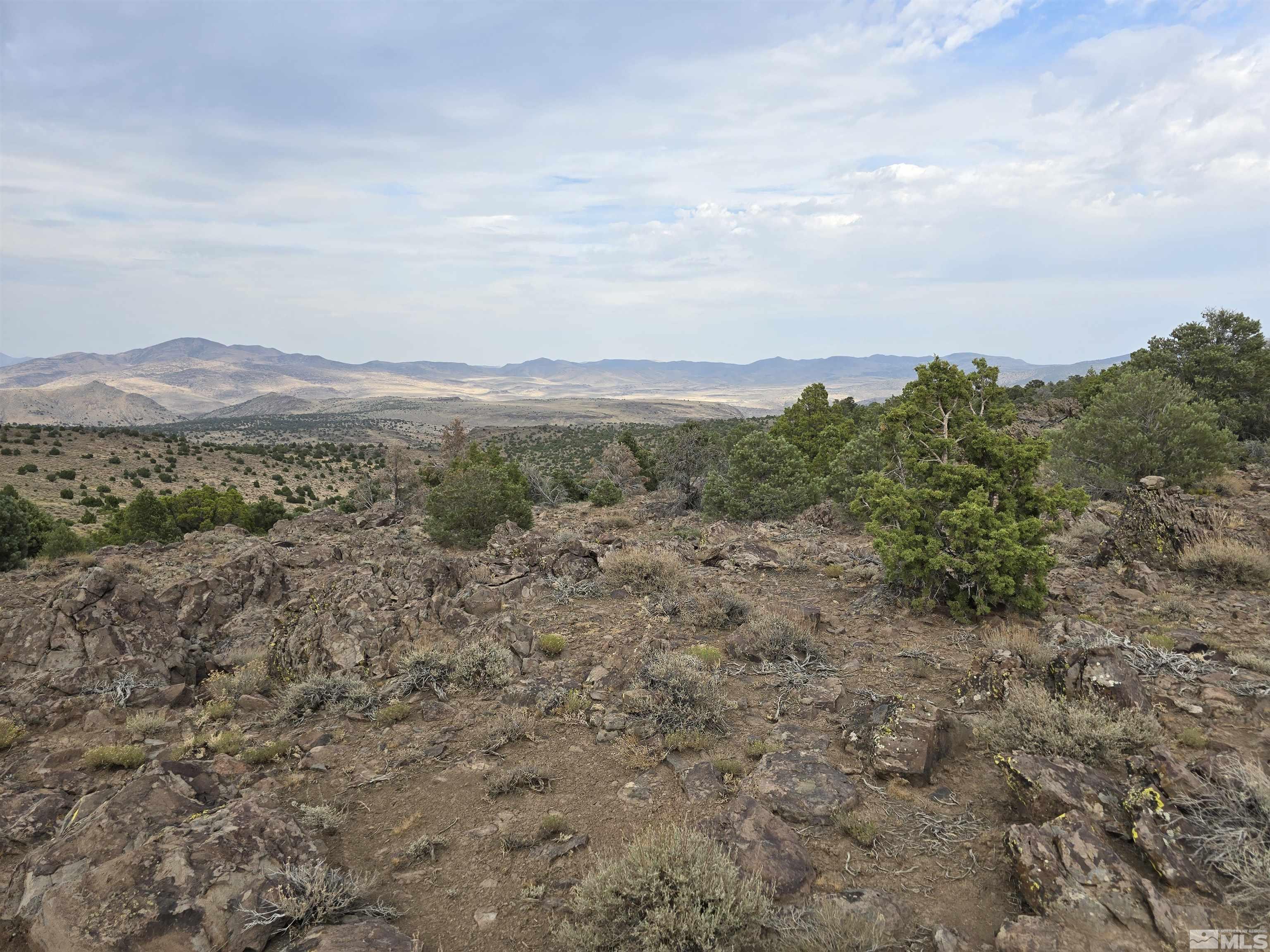 4-221-02 Reno, NV 89521 - Photo 12 of 21 a view of a large mountain with mountains in the background