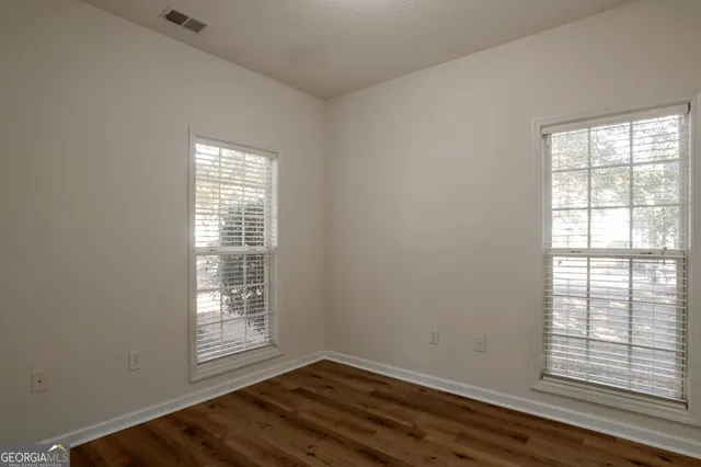 an empty room with windows