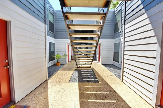 a view of a balcony with a furniture