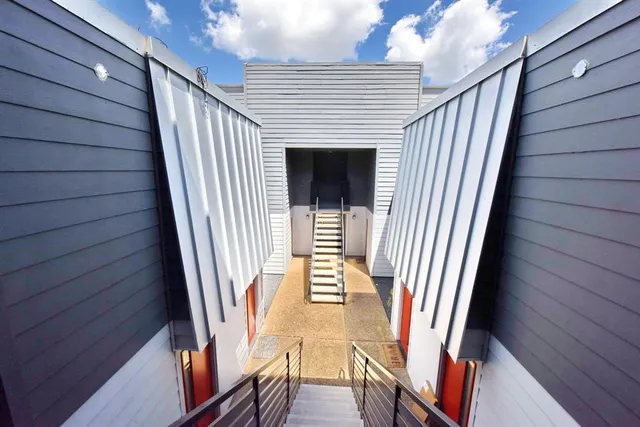 a view of an entryway with wooden floor