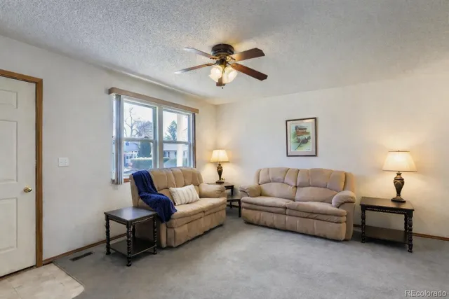 a dining room with furniture and garden view