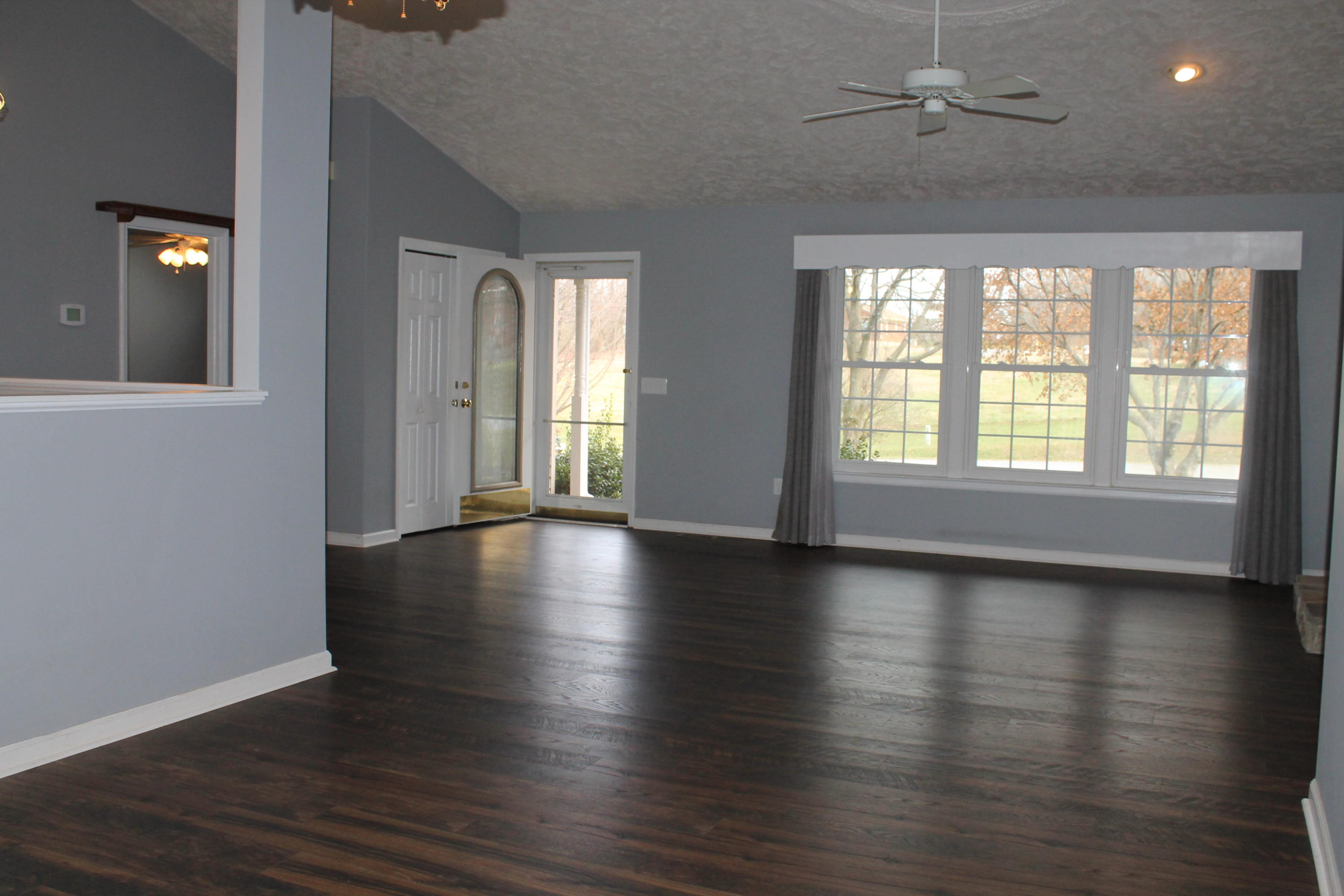 101 Aftons Meadow Road Vinton, VA 24179 - Photo 2 of 55 a view of an empty room with wooden floor and a window