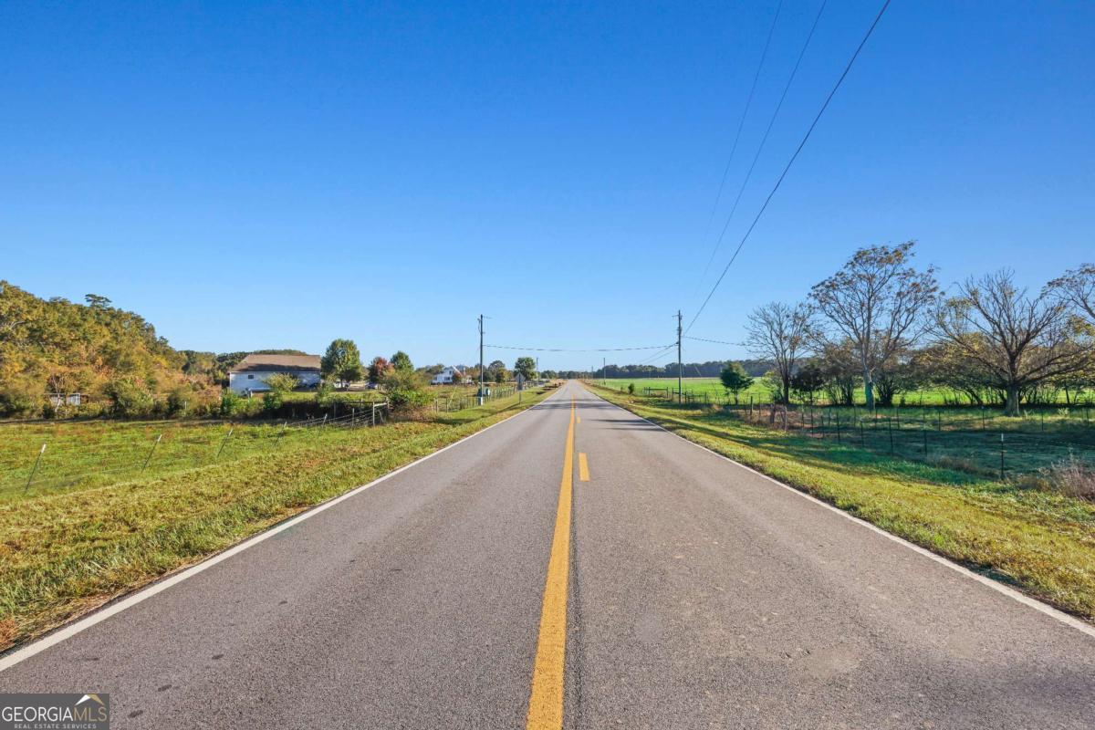 1210 Carson-Graves Road, Unit 2B Watkinsville, GA 30677 - Photo 5 of 14 a view of a lake with a big yard