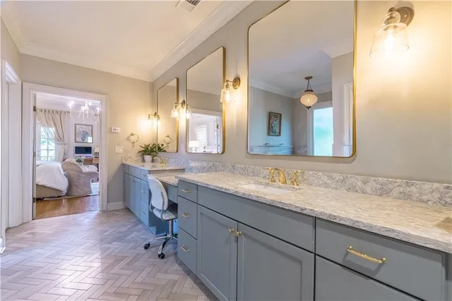 a bathroom with a granite countertop sink mirror and double