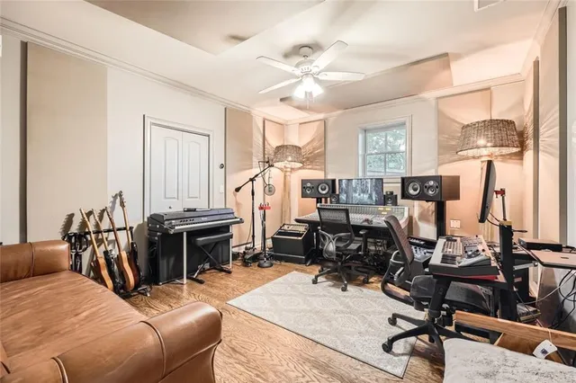 a view of a livingroom with workspace and a window