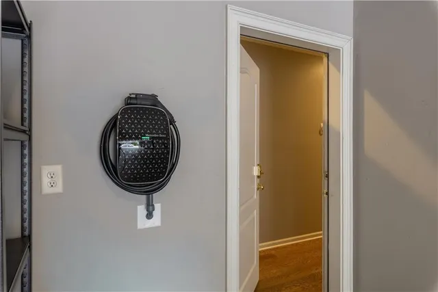 a room with painting on the wall and a window