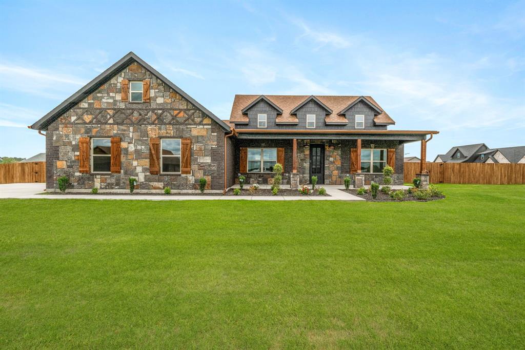 1008 Barton Ranch Road Nemo, TX 76070 - Photo 1 of 1 a front view of a house with garden